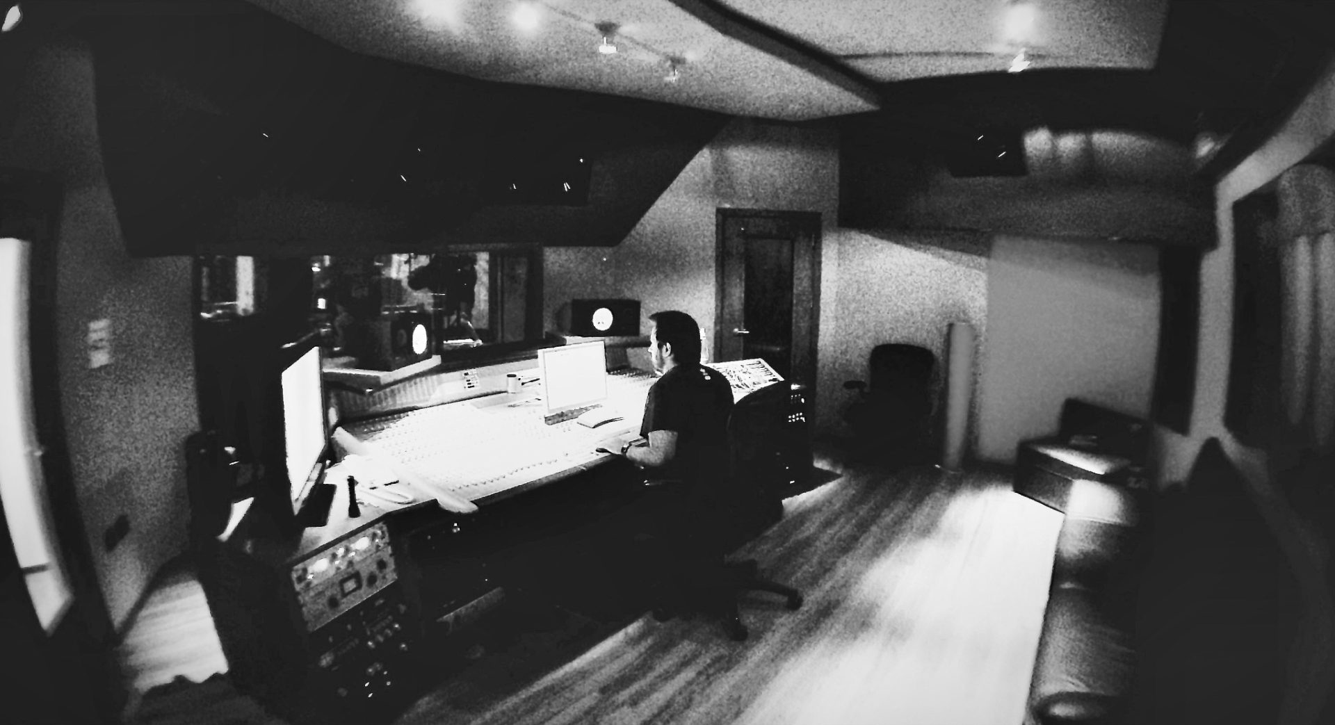 The MMQ control room: a large mixing console, monitors and outboard racks in a treated studio.
